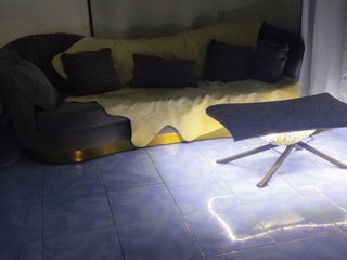 Curvafix form coffee table with under-table lighting.